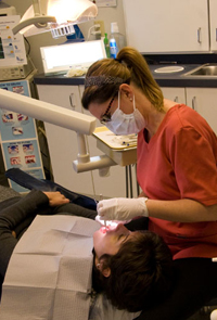 Aimee Cleaning a Patient's Teeth